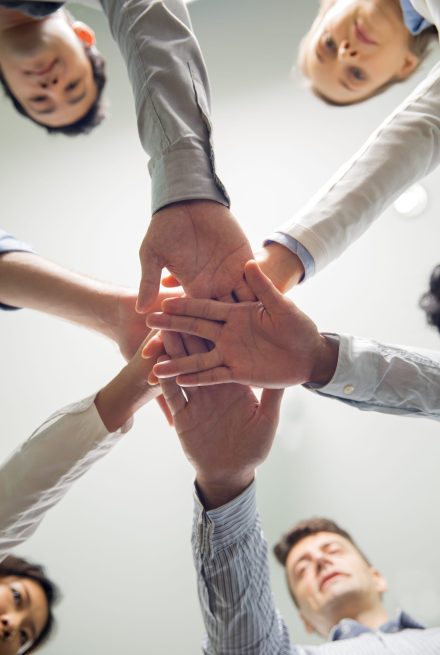 successful-business-team-stacking-hands